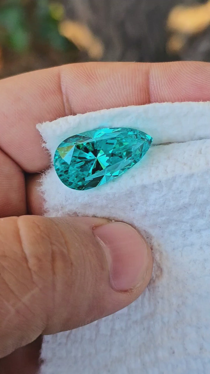 Teal "Paraiba" YAG, Pear Internal Reflections Cut,  22 Carats