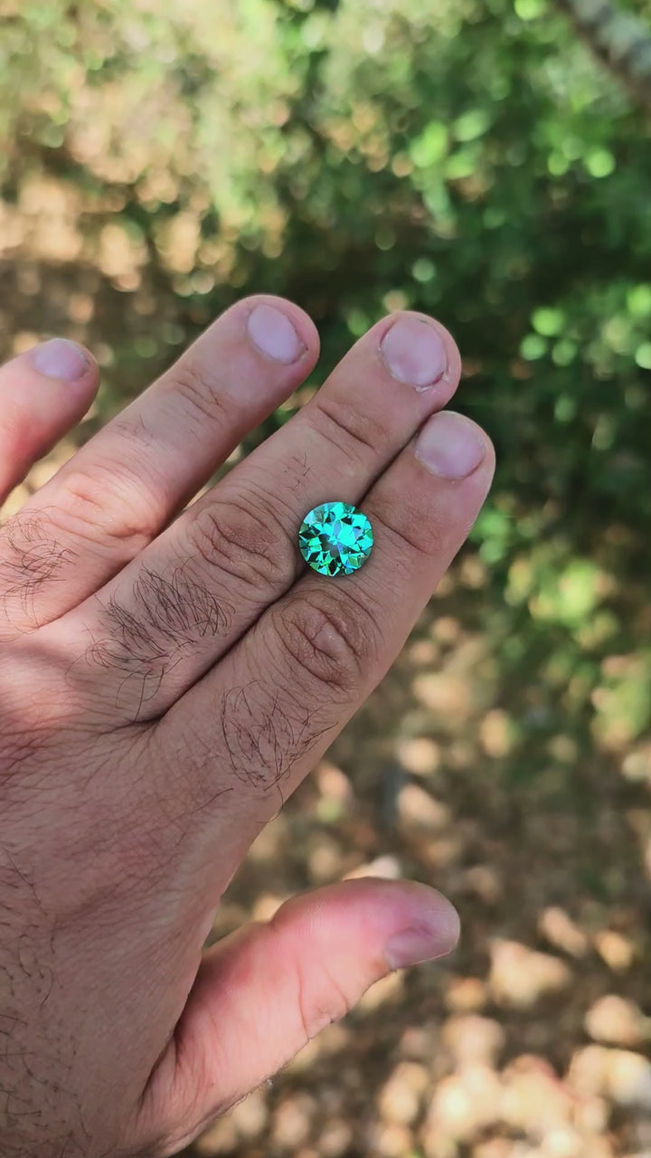 Teal "Paraiba" YAG, Traditional Round Brilliant Cut, 9.72 Carats