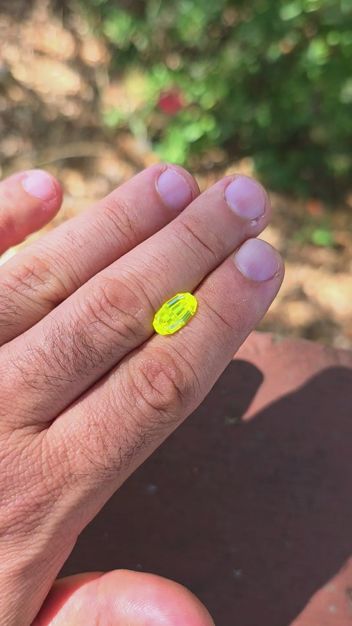 "Ultra" Glow In The Dark Lab Garnet, Long Step Oval Cut, 5.90 Carats