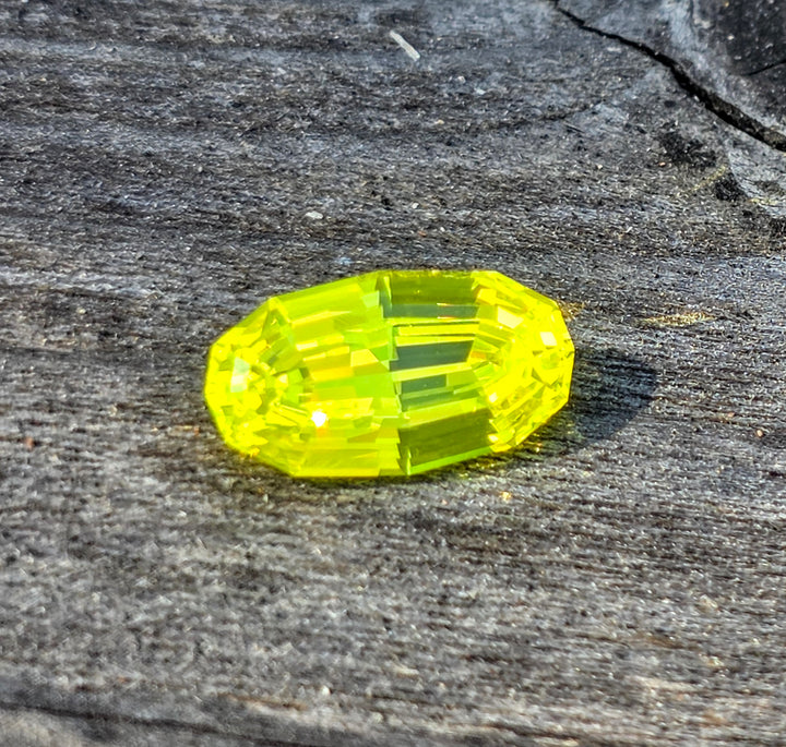 "Ultra" Glow In The Dark Lab Garnet, Long Step Oval Cut, 5.90 Carats