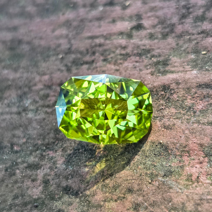 Peridot Green Colored Lab Sapphire, Cushion Internal Reflections Cut, 5.18 Carats